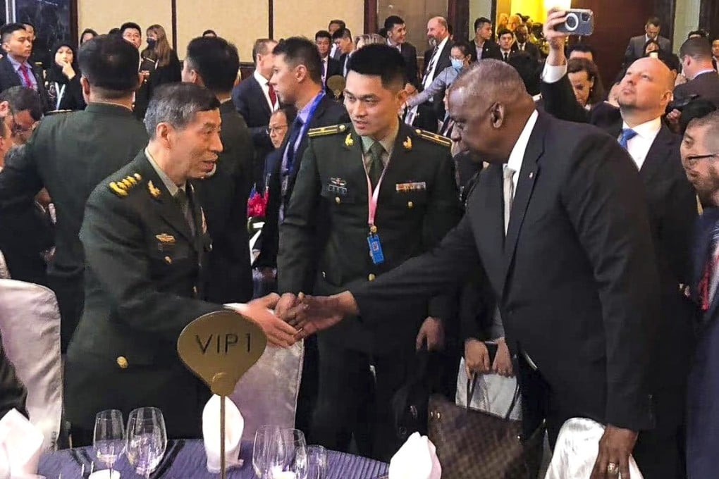 Chinese defence chief General Li Shangfu shakes hands with US Defence Secretary Lloyd Austin in Singapore in June. Photo: via Weibo
