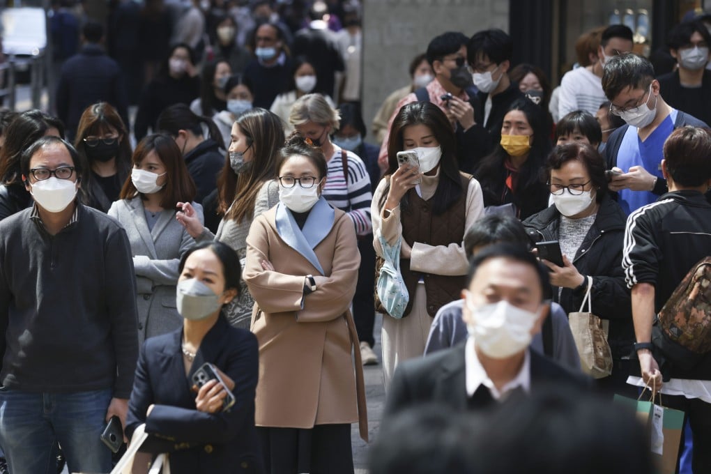 Commuters wear masks in Central, Hong Kong, on February 28, 2023. Cliff Buddle returned to the UK from Hong Kong in August 2022 and managed to survive over a year without catching Covid-19. Photo: May Tse