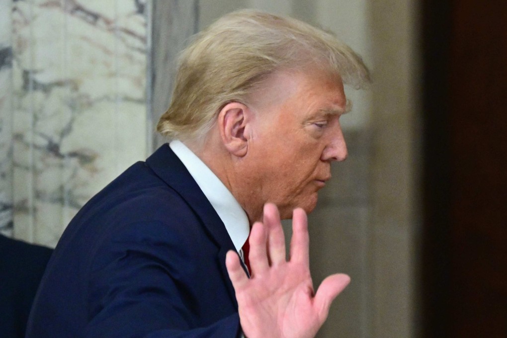 Former US president Donald Trump waves after speaking to the media during the third day of his civil fraud trial in New York on Wednesday. Photo: AFP