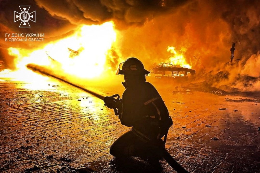 A firefighter tries on Friday to contain the damage caused by a Russian drone strike at a Ukrainian port in the Odesa region. Photo: State Emergency Service of Ukraine via Reuters