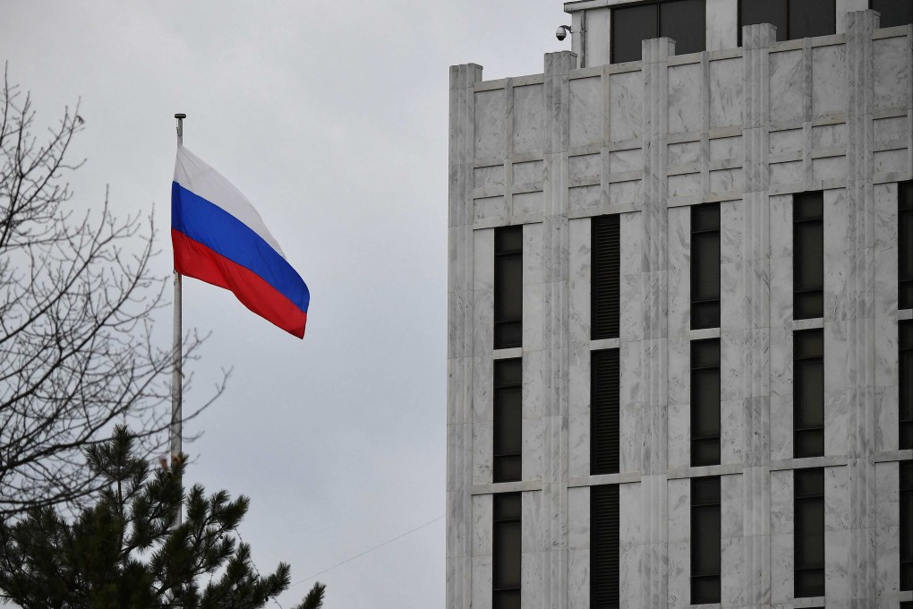A Russian flag flutters in front of Russia’s embassy in Washington in February 2022. Photo: AFP