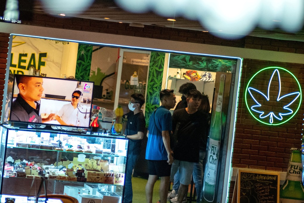 Tourists shop in a cannabis store in Bangkok. Malaysian cannabis smokers have flocked across the border, entering by car through the south or flying to tourist hotspots. Photo: Reuters