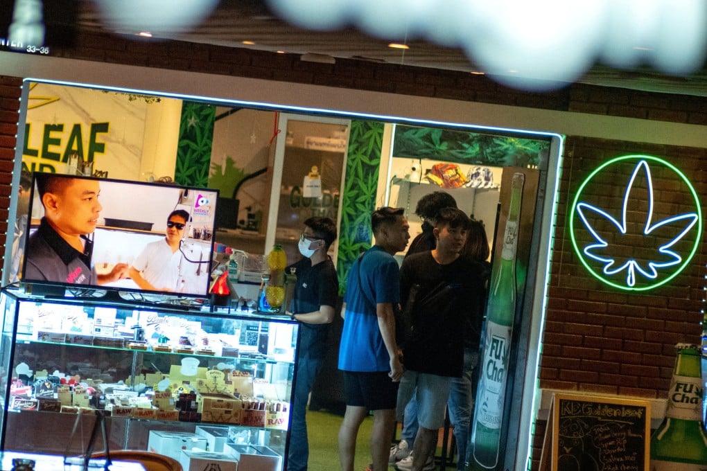 Tourists shop in a cannabis store in Bangkok. Malaysian cannabis smokers have flocked across the border, entering by car through the south or flying to tourist hotspots. Photo: Reuters