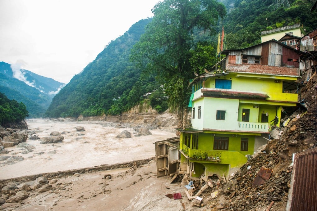 Houses damaged by the flood at the bank of Teesta River at Dikchu in Sikkim, India. Photo: Reuters