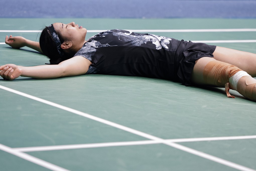 An Se-young of South Korea is exhausted after clinching women’s singles badminton gold in Hangzhou. Photo: Xinhua