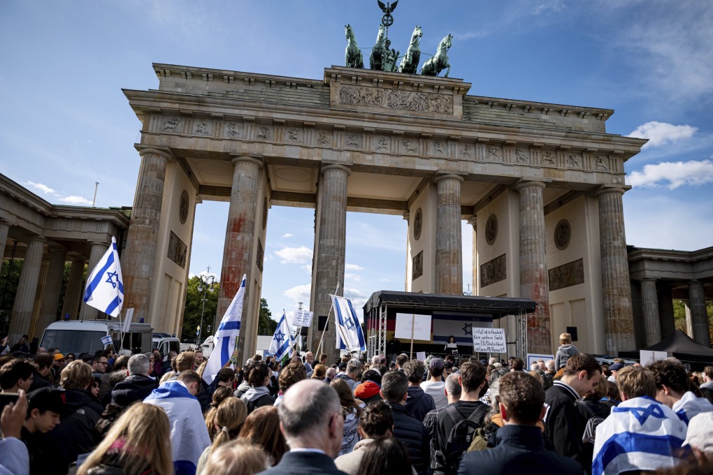 People take part in a solidarity demonstration with Israel on Pariser Platz at the Brandenburg Gate in Berlin on Sunday. Photo: dpa via AP