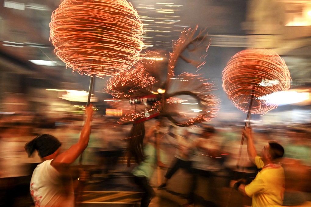 Members of the fire dragon dance team perform during the Tai Hang Fire Dragon parade in Hong Kong on September 29, 2023. The police did a superb job of controlling the event, Jason Wordie says. Photo: AFP