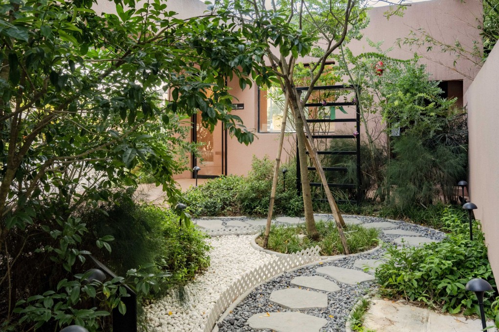 Visitors to the Home of Forever Love in Hong Kong circumnavigate the leafy plot partly on paving stones that curve around a crepe myrtle feature tree. The crematorium’s design reflects how architecture can be used to affect emotions. Photo: Eugene Chan
