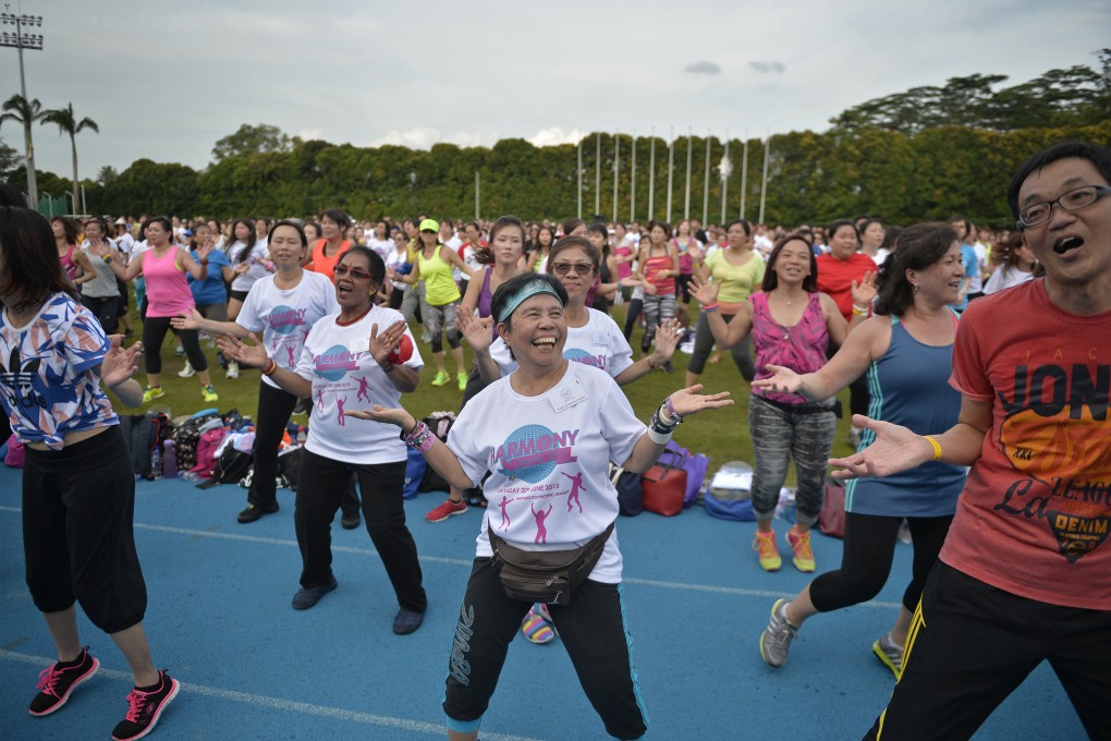 More than 3,500 set a record for the largest zumba dance in Singapore on June 20, 2015, part of efforts by the Thye Hua Kwan Moral Society to promote interracial and interreligious harmony. Singapore is an example of an Asian state with successful strategies to address multi-ethnic stresses and forge dynamic and stable multicultural communities. Photo: SPH