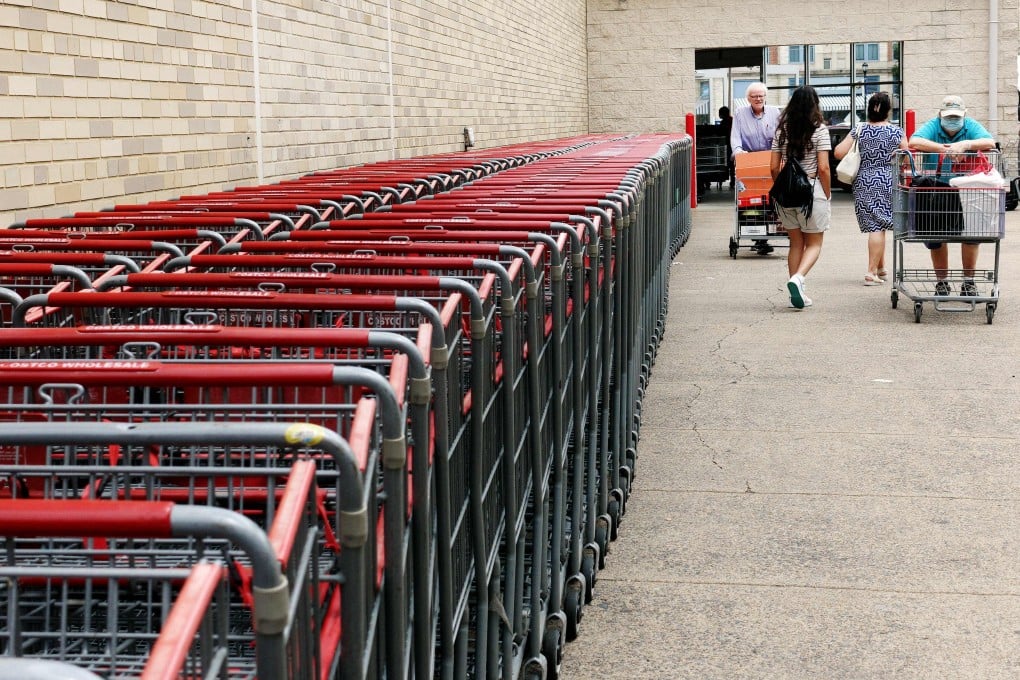People walk outside a Costco in Arlington, Virginia. A growing number of economists predict a soft landing for the US economy, but concerning reports on credit card debt, oil prices, political dysfunction and more suggest that consensus might not be as solid as it first appears. Photo: AFP