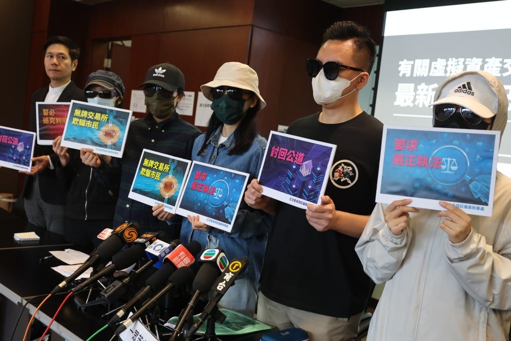 Lawmaker Johnny Ng (left) and victims of the JPEX cryptocurrency scandal meet the press on Thursday. Photo: Edmond So