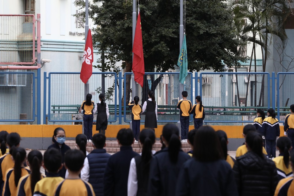 Students take part in a flag-raising ceremony at a school run by a Buddhist organisation in Kwai Fong on January 3, 2022. Photo: Jonathan Wong