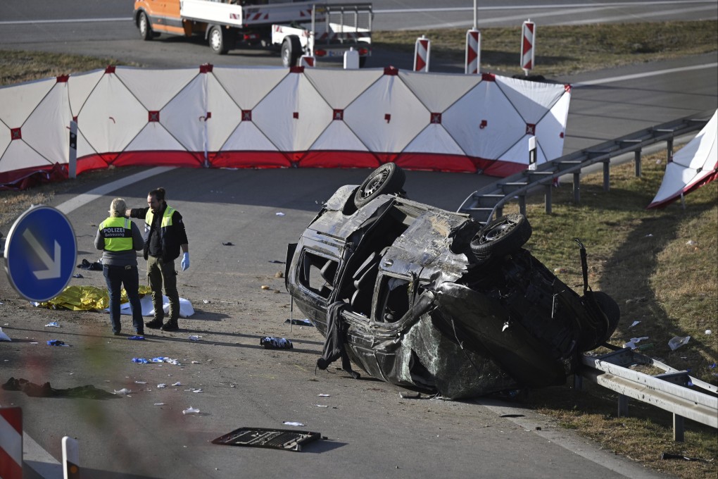 Police stand by the overturned vehicle on a motorway in Germany after it crashed, killing seven people. Photo: AP