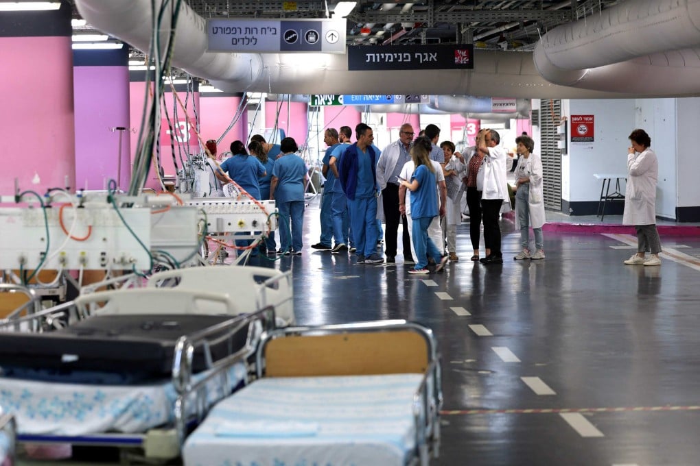 Medical staff arrange a makeshift emergency underground hospital in the parking lot of the Rambam Health Care Campus in Haifa in northern Israel. Photo: AFP