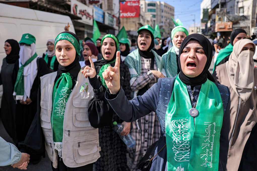Women chant slogans while marching in a rally in solidarity with Gaza, in the city of Hebron in the occupied West Bank on Friday. Photo: TNS