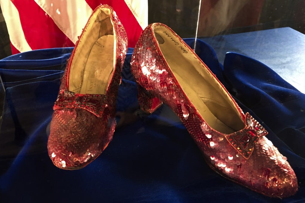 A pair of ruby slippers once worn by actress Judy Garland in the “The Wizard of Oz” sit on display at a news conference at the FBI office in Brooklyn Centre, Minnesota, in September 2018. Photo: AP