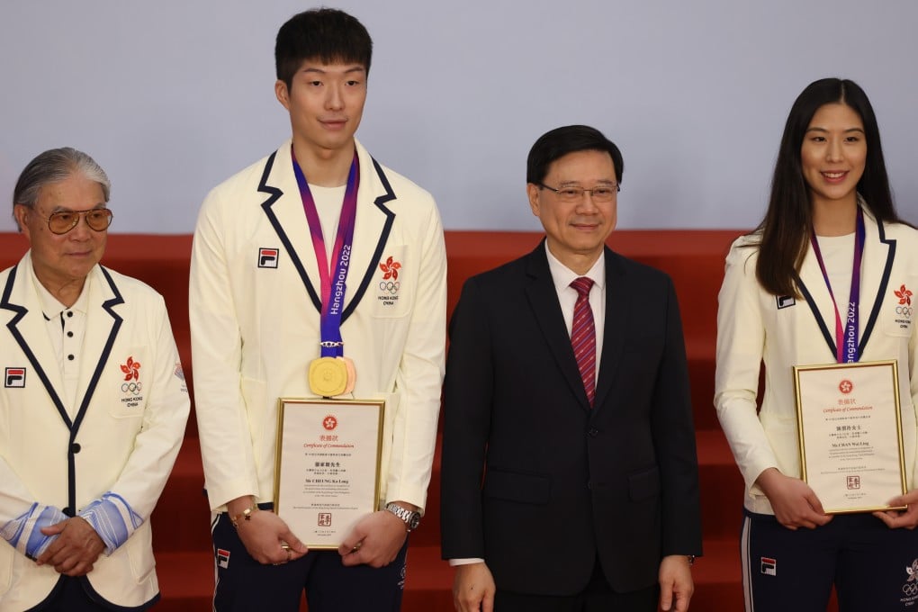 (From left) Timothy Fok of the Olympic Committee, fencer Cheung Ka-long, Hong Kong Chief Executive John Lee and fencer Chan Wai-ling at the reception. Photo: Yik Yeung-man