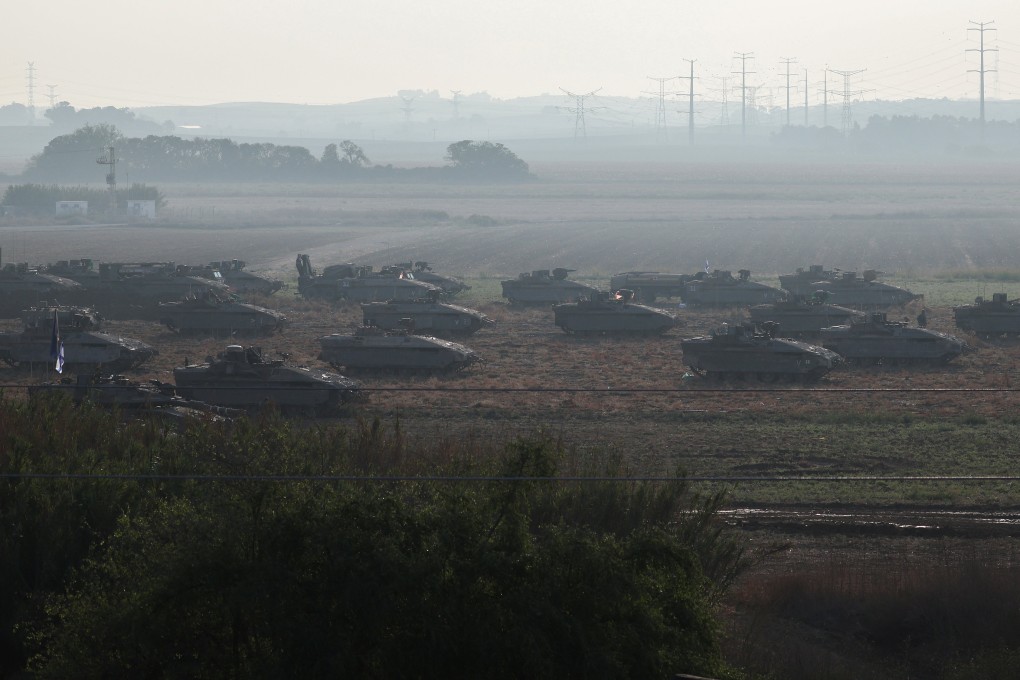 Israeli tanks and military vehicles take position near Israel’s border with the Gaza Strip, in southern Israel. Photo: Reuters