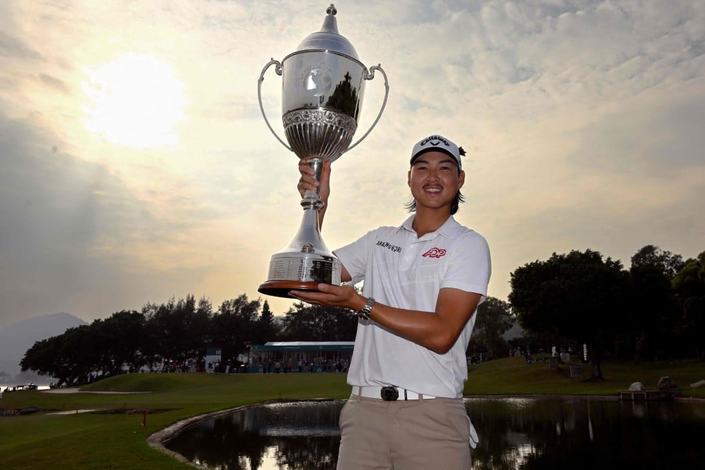 Min-woo Lee celebrates with the winner’s trophy at the Macau Golf and Country Club. Photo: AFP