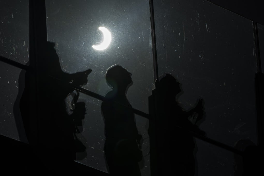 People watch a rare “ring of fire” solar eclipse along the Las Vegas Strip on Saturday. Photo: AP