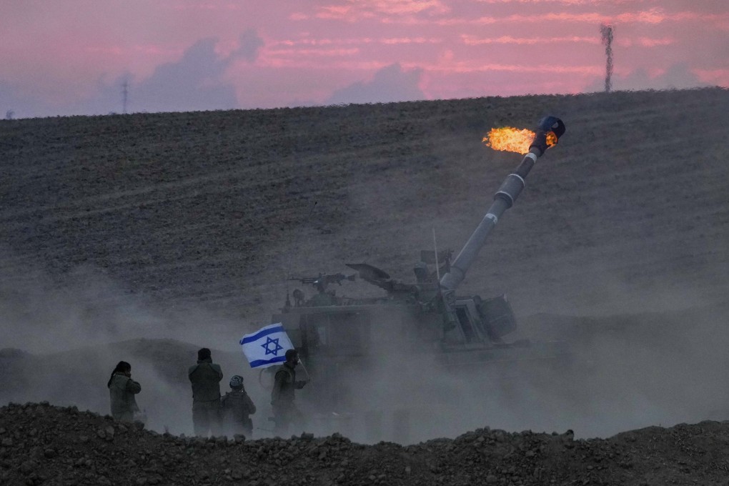 An Israeli artillery unit fires a shell towards the Gaza Strip from a position near the border. Photo: AP