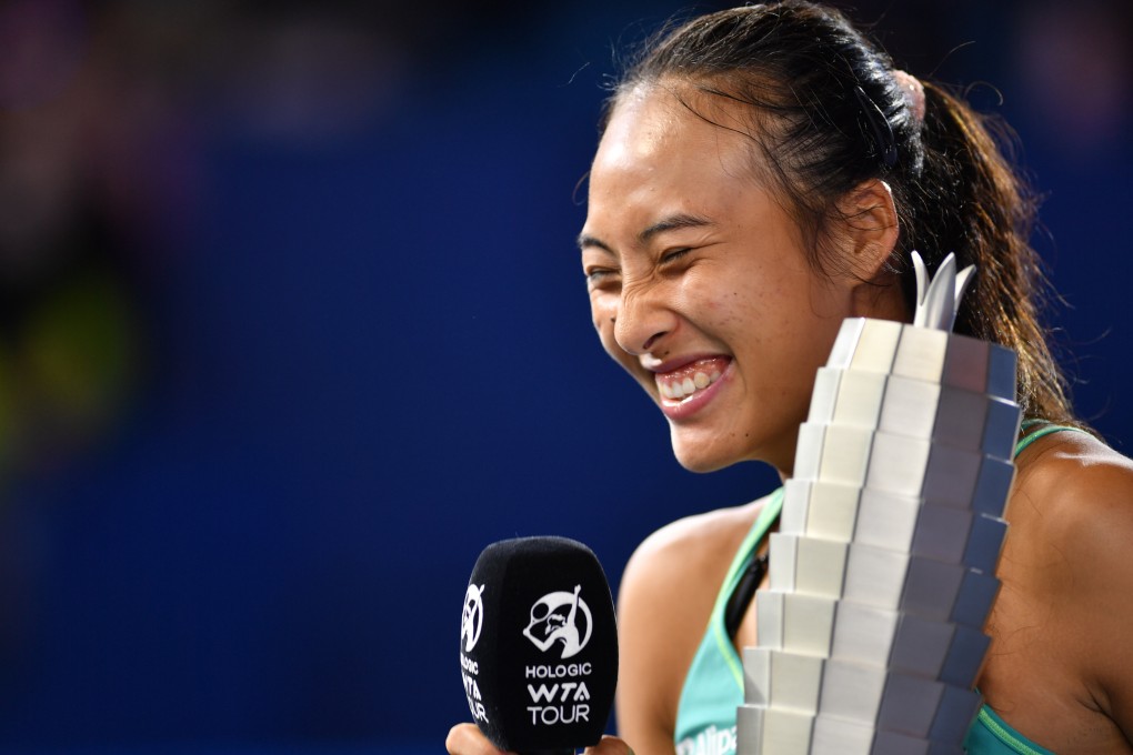 Zheng Qinwen celebrates with the trophy after winning the Zhengzhou Open final. Photo: Xinhua