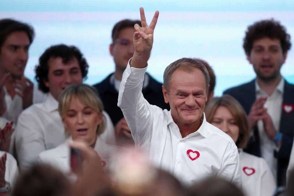 Donald Tusk, leader of Poland’s Civic Coalition (KO), gestures after exit poll results are announced in Warsaw, Poland on Sunday. Photo: Reuters