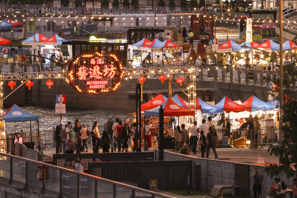 People enjoy food and drinks at a waterfront carnival in Wan Chai on October 13 held as part of the government’s ‘Night Vibes’ campaign. Photo: Yik Yeung-man