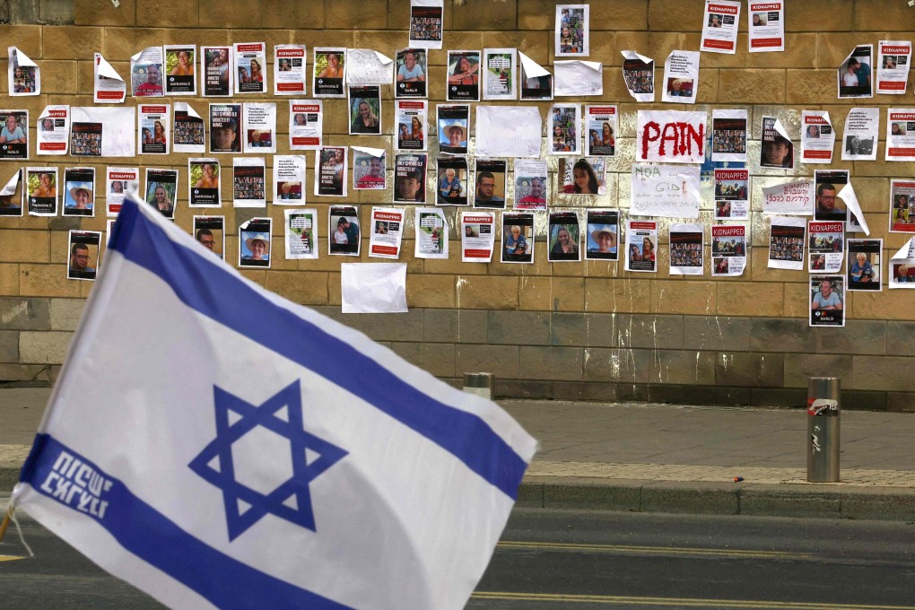 A wall in Tel Aviv, Israel, plastered with images of Israeli hostages snatched by Hamas during the  October 7 attack. Photo: AFP