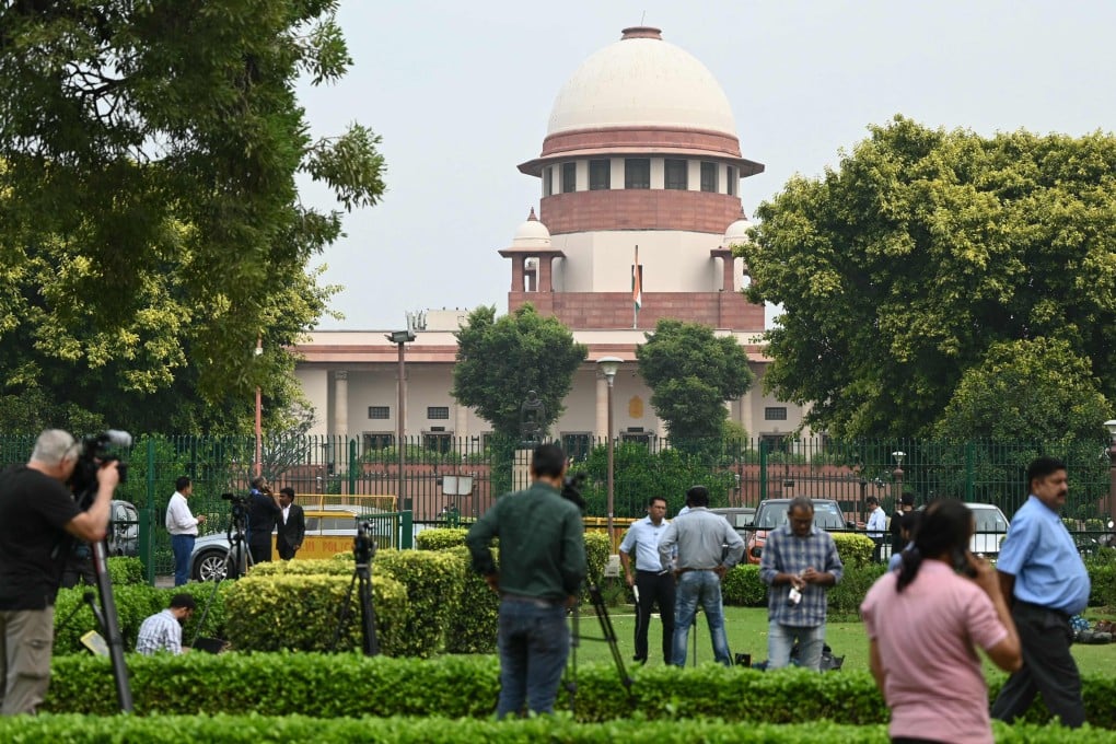 Journalists outside the Supreme Court of India in New Delhi on Tuesday ahead of its ruling on same-sex marriages. Photo: AFP