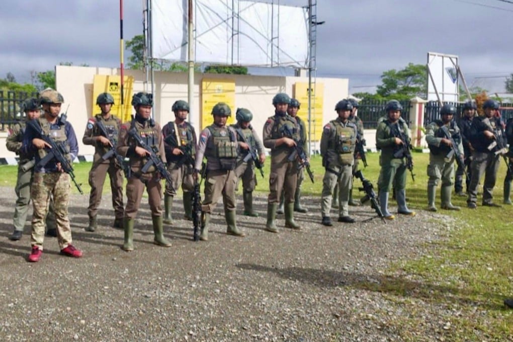 Cartenz Peace Task Force shows troops preparing to retrieve the victims shot by armed rebels i, Papua province, Indonesia. Photo: Handout/Cartenz Peace Task Force/AFP