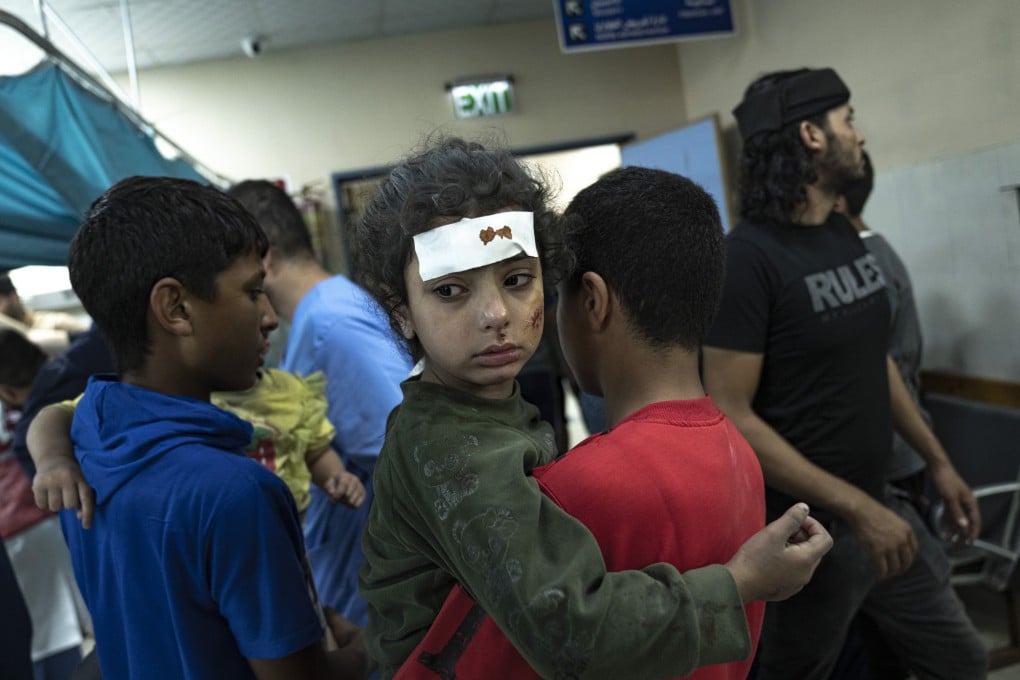 Palestinians wounded in Israeli bombardment of the Gaza Strip arrive at a hospital in Khan Younis on Monday. Photo: AP