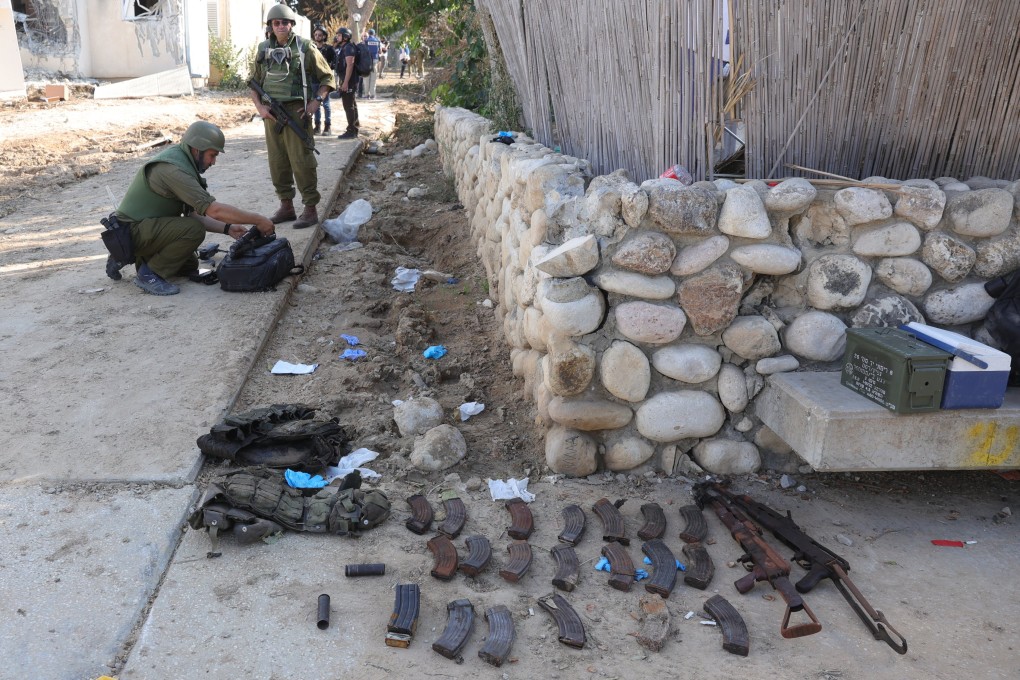 Weapons belonging to Hamas militants lie on the ground at the Kfar Aza Kibbutz, Israel, which was attacked by Hamas on October 7. Photo: EPA-EFE
