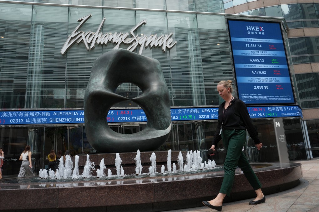 People walk through the piazza in front of the headquarters of Hong Kong Exchanges and Clearing Limited (HKEX), Central. Photo: Elson LI