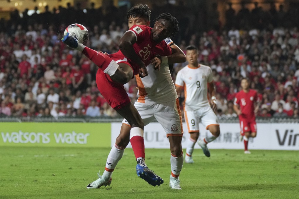 Hong Kong’s Michael Udebuluzor (in red) scored twice at home to Bhutan, but his side struggled in the second leg. Photo: Elson Li