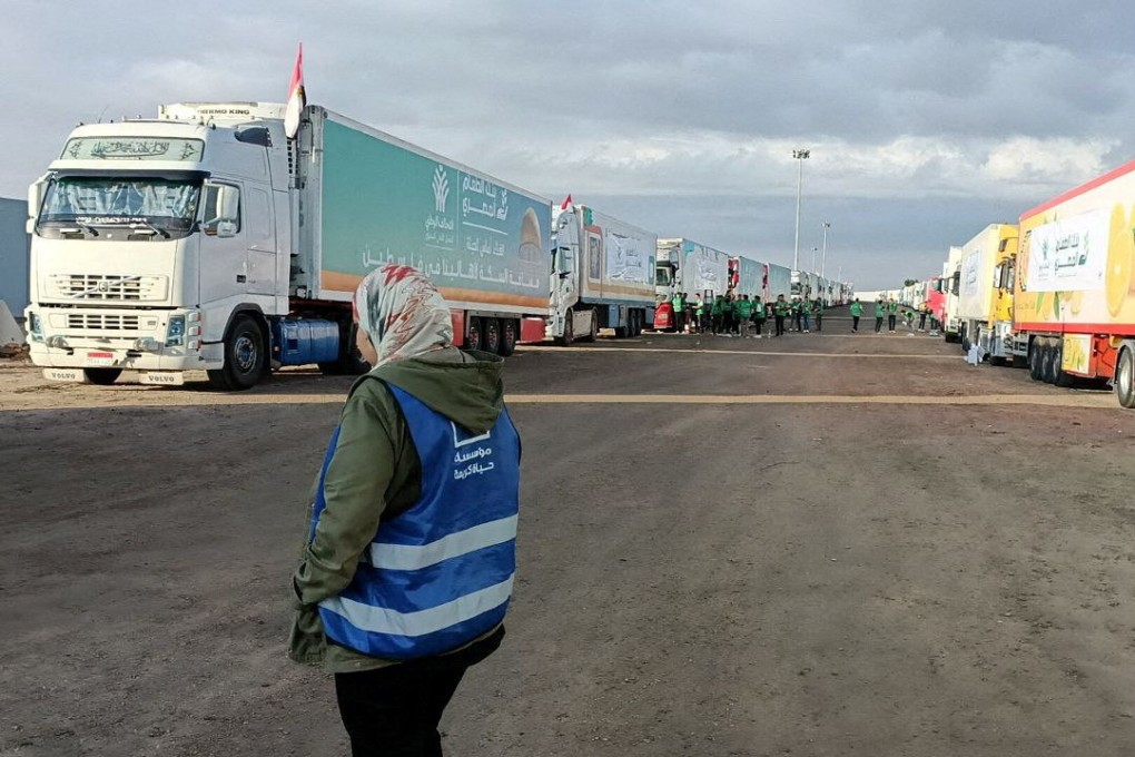 Trucks carrying humanitarian aid from Egyptian NGOs for Palestinians wait for the reopening of the Rafah crossing at the Egyptian side on Tuesday. Photo: Reuters