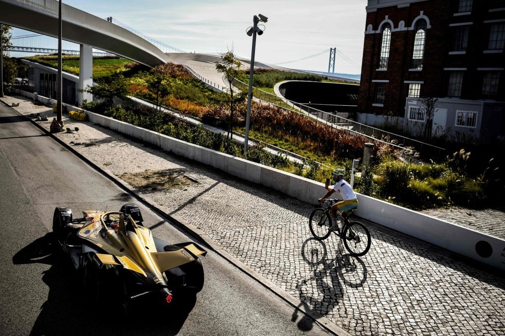 Portuguese Formula E driver and world champion Antonio Felix da Costa drives through Belem during a Formula E Roadshow in Lisbon. Photo: AFP