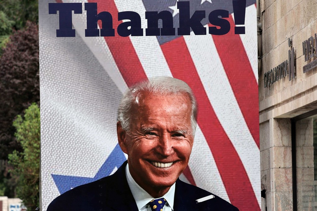 A giant poster of US President Joe Biden in a Jerusalem street. Photo: AFP