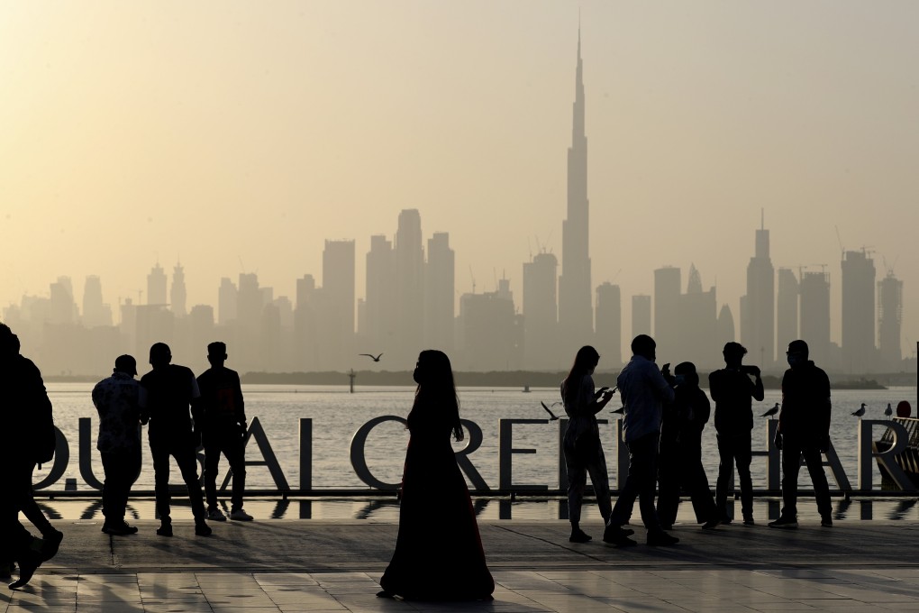 People enjoy their weekend with the view of city skyline and the world tallest tower, Burj Khalifa, in Dubai, United Arab Emirates, on January 29, 2021. Photo: AP