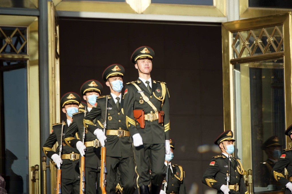 Members of the People’s Liberation Army march outside the Great Hall of the People in Beijing, China, on Wednesday. Photo: Bloomberg