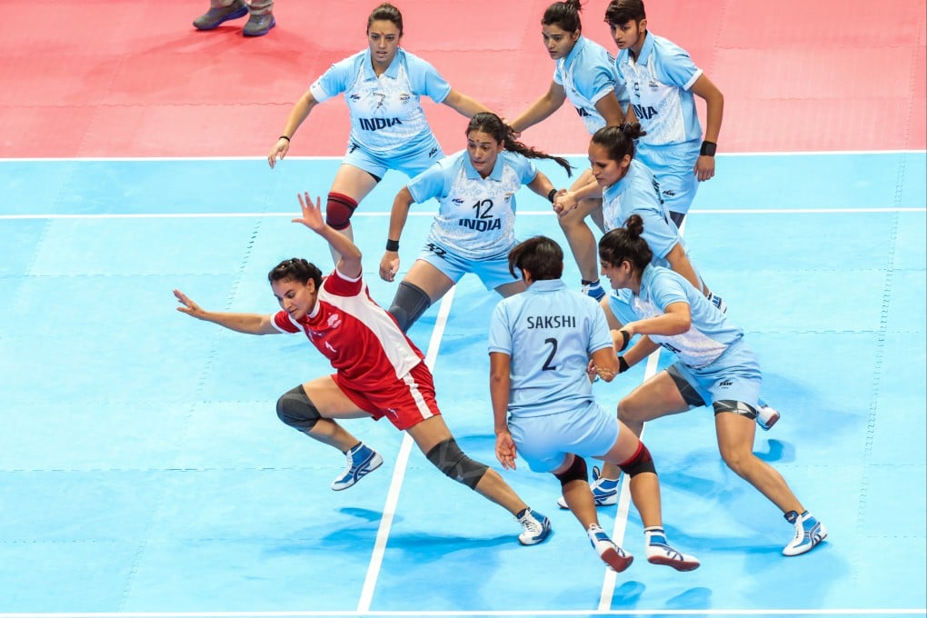 Manmati Bist (in red) of Nepal competes during the women’s team semi-final of kabaddi between India and Nepal at the 19th Asian Games in Hangzhou. Sports such as kabaddi, which lack the mass appeal of football, cricket or volleyball, are often pushed into the margins in Nepal. Photo: Xinhua