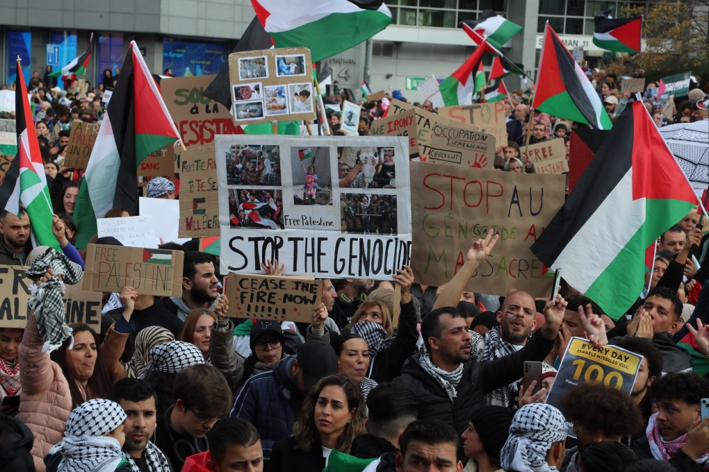 People hold placards and Palestinian flags during a Pro-Palestine demonstration in Brussels, Belgium. The demonstration is calling for an immediate ceasefire and respect for international law. Photo: dpa