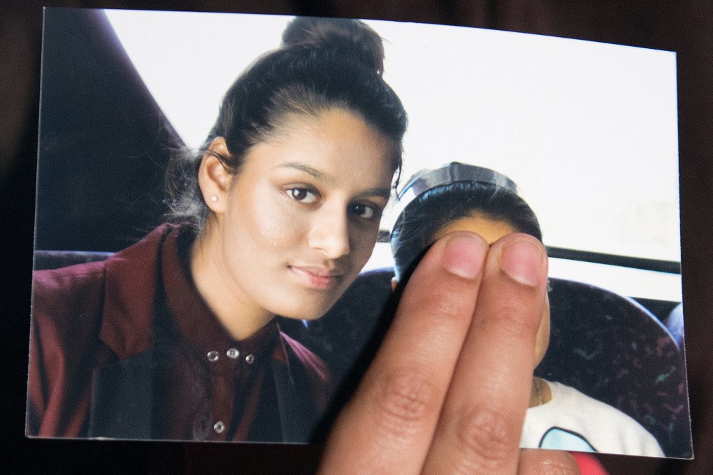 Renu Begum, sister of teenage British girl Shamima Begum, holds a photo of her sister as she makes an appeal to have her British citizenship renewed. Photo: Reuters