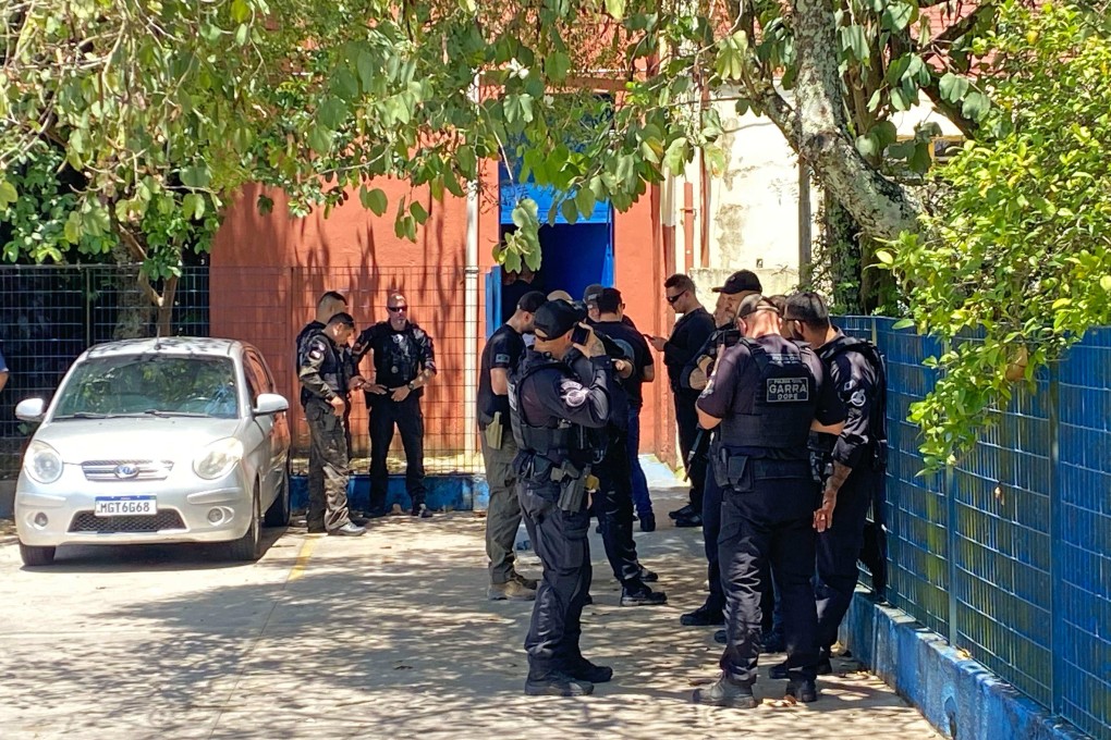 Police officers gather near Sapopemba public school following a shooting in Sao Paulo, Brazil on Monday. Photo: AFP