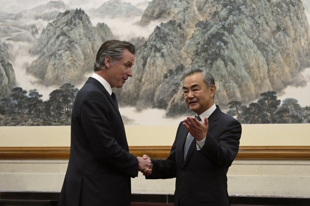California Governor Gavin Newsom shakes hands with Chinese Foreign Minister Wang Yi in Beijing on Wednesday morning. Photo: AP