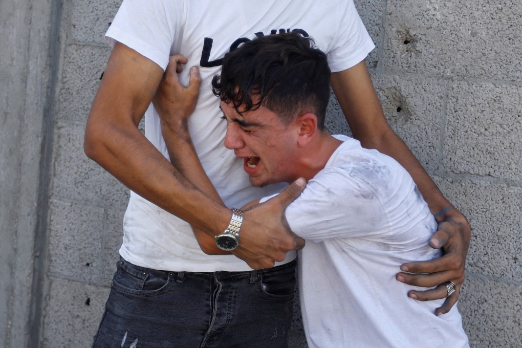 A Palestinian man reacts during a search for casualties following an Israeli strike on a house in the southern Gaza Strip on Wednesday. Photo: Reuters