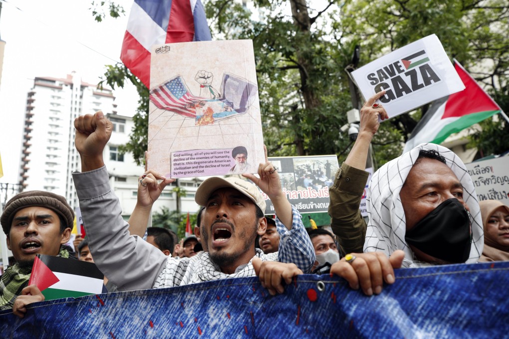 Thai-Muslim demonstrators hold placards and shout slogans during a protest against Israel and in solidarity with the Palestinian people at the Israeli embassy in Bangkok, Thailand, on Saturday. Photo: EPA-EFE