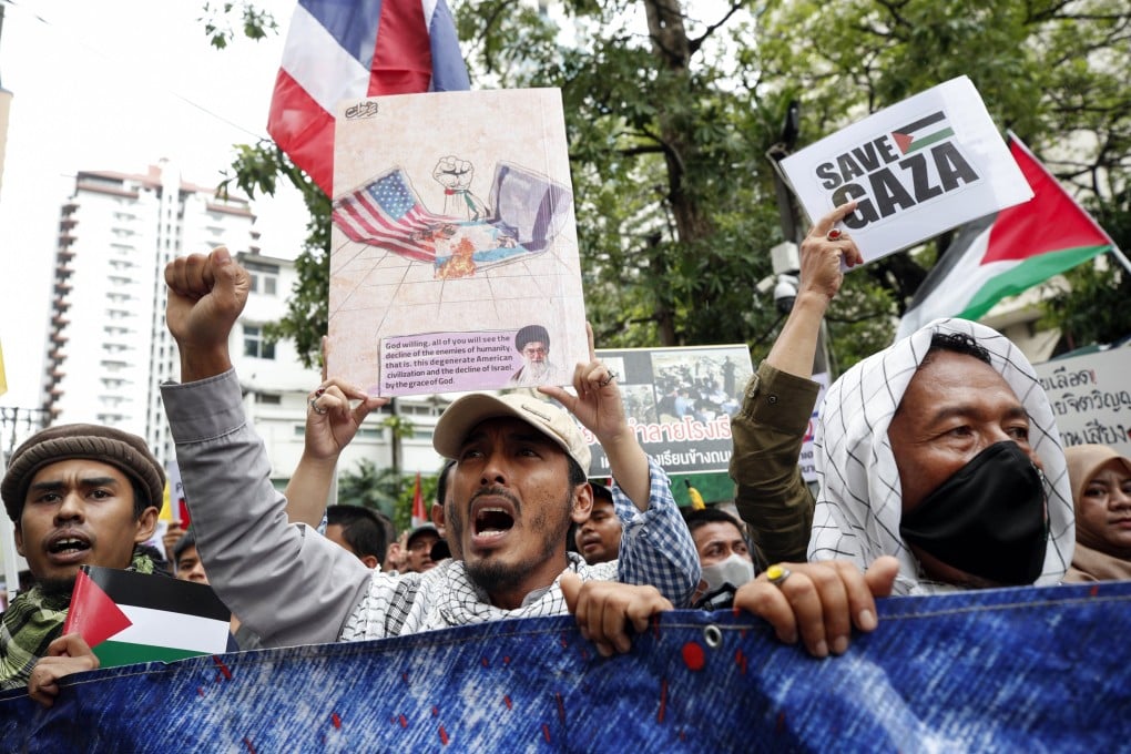 Thai-Muslim demonstrators hold placards and shout slogans during a protest against Israel and in solidarity with the Palestinian people at the Israeli embassy in Bangkok, Thailand, on Saturday. Photo: EPA-EFE