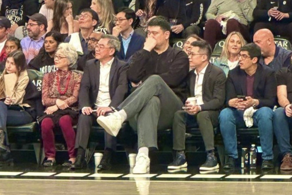 Yao Ming casts a towering figure as he sits courtside at the Barclays Centre. Photo: X/@BusterScher