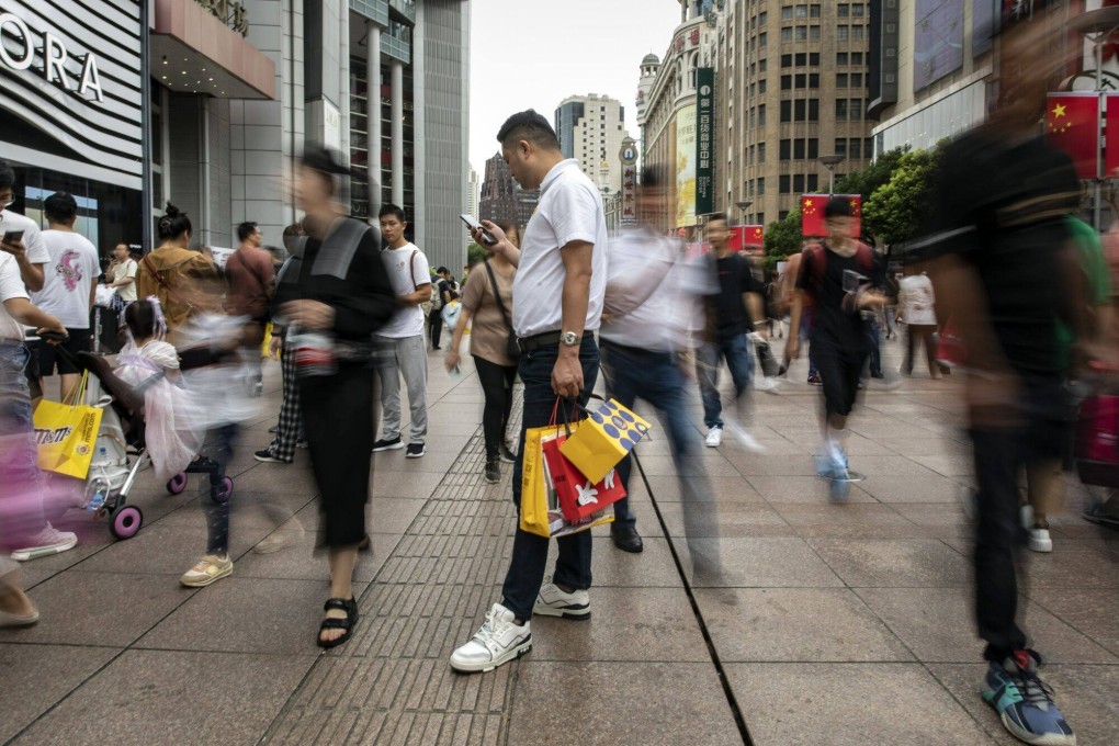 Pedestrians and shoppers on Nanjing Road in Shanghai on October 3, 2023. Photo: Bloomberg